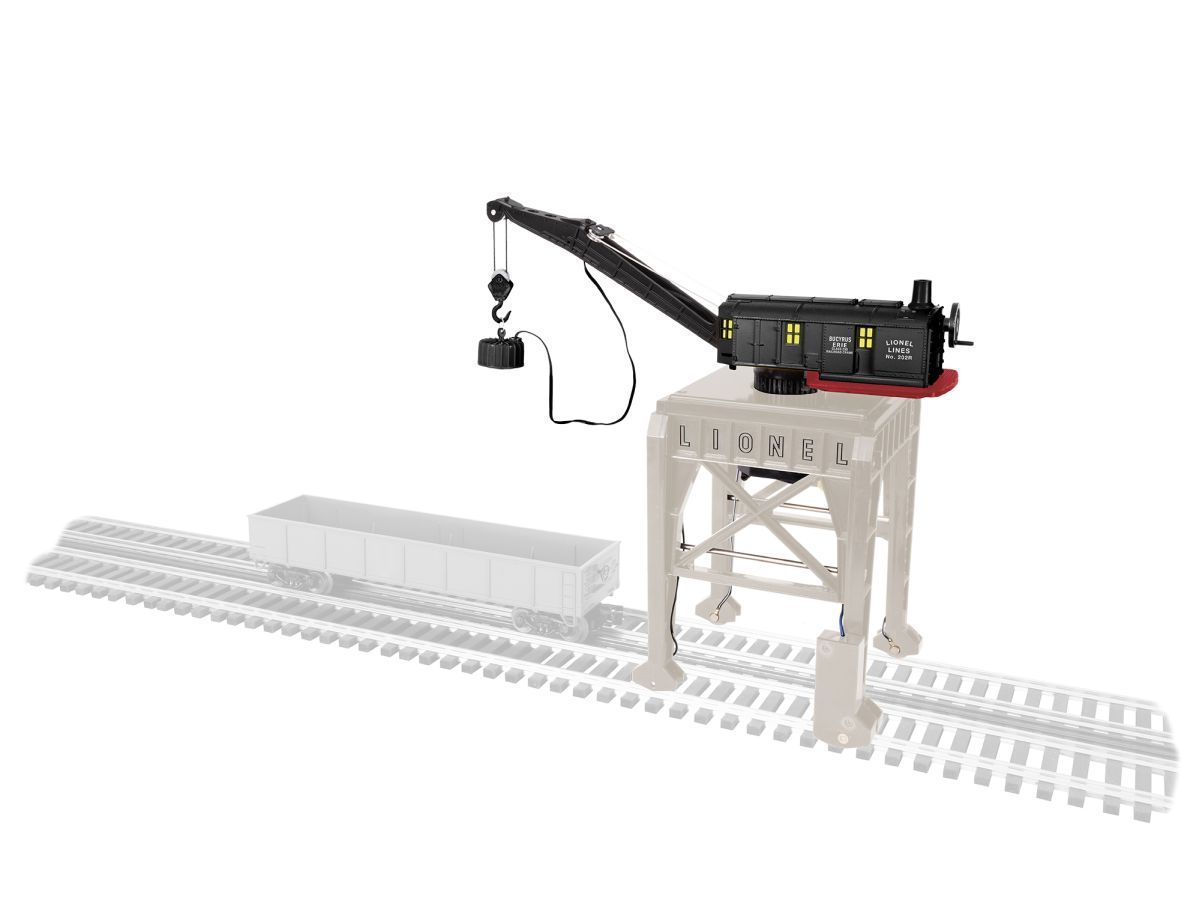 Small crane on a raised platform beside a white Lego-style structure and rail tracks