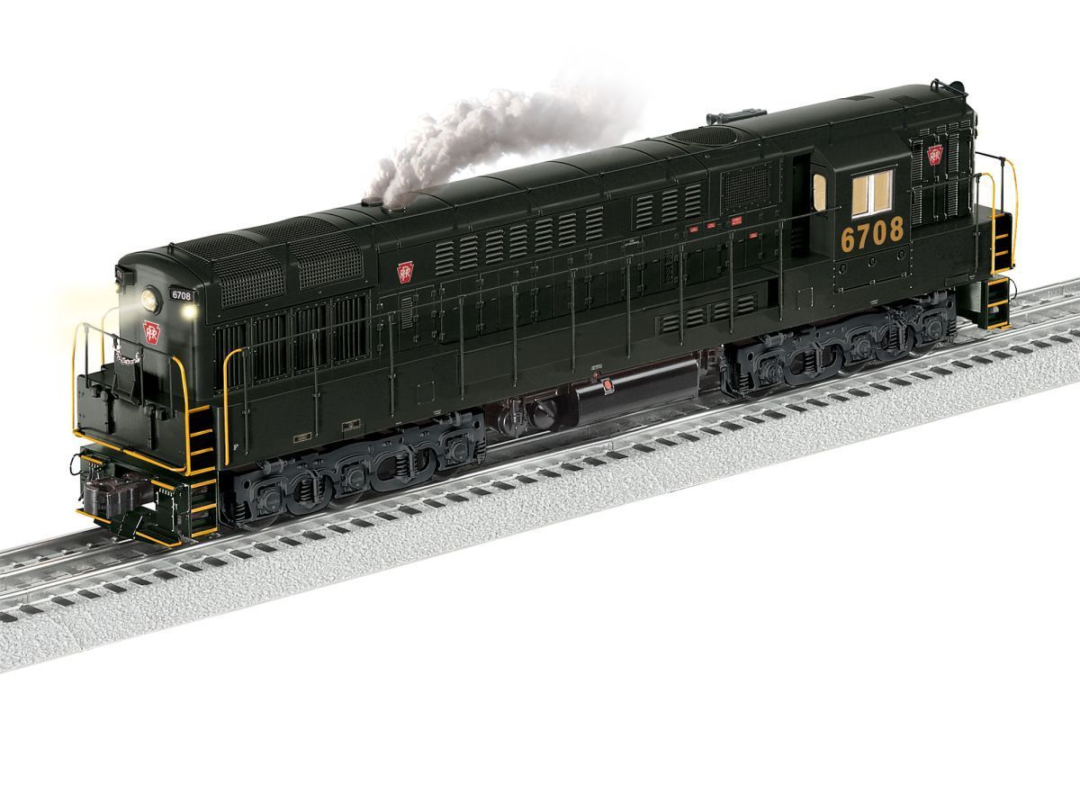 Black model diesel locomotive on tracks, numbered 6708, with smoke rising from the roof.