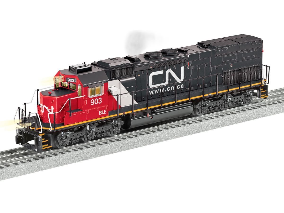 Red and black CN locomotive model on gray track, with black freight car and visible number 903.