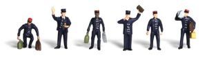 Six toy police figures in dark uniforms, each posing with different hand gestures on a white background.