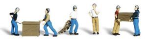 Two miniature workers moving a cardboard box across a white background