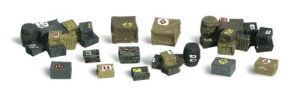 Assorted small cube-shaped objects in green, brown, and gray arranged on a white background