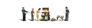 Miniature business meeting scene with three people, bookshelf, and office furniture on a white background