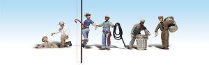 Lineup of small figurines on white background, separated by a vertical line; one lies on the left, others stand on the right