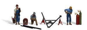 Workers installing a black metal structure, with tools and safety gear on a white background