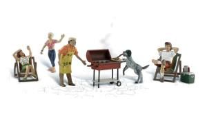 Miniature toy orchestra with conductor, pianist, cello, and violin players around a grand piano.