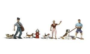 Miniature figures with dogs and a red fire hydrant, arranged in a playful street scene.