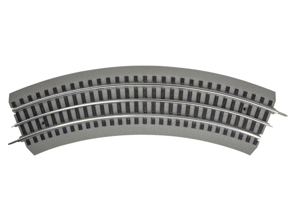 Curved gray model railroad track section on a white background