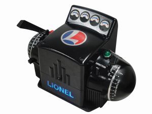Black Lionel toy train engine with gauges, a red-white-blue emblem, and a green button on top