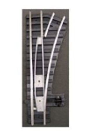 Curved metal track switch on a wall-mounted panel with electrical components