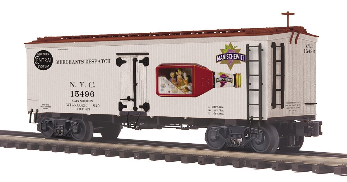 White XTC boxcar model train with black lettering and red center panel on a plain background