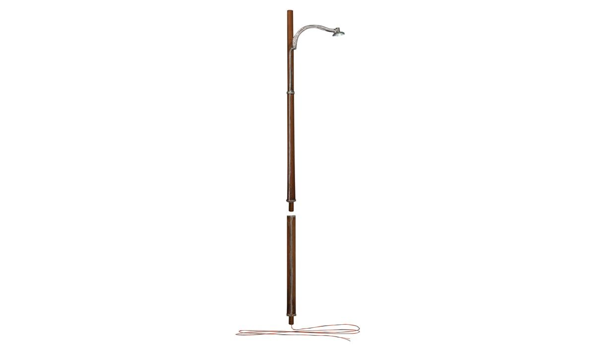 Tall brown pole with a curved top and white crossbars on a plain white background