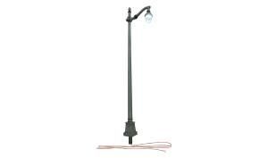 Black outdoor street lamp with a curved arm and hanging light on a white background