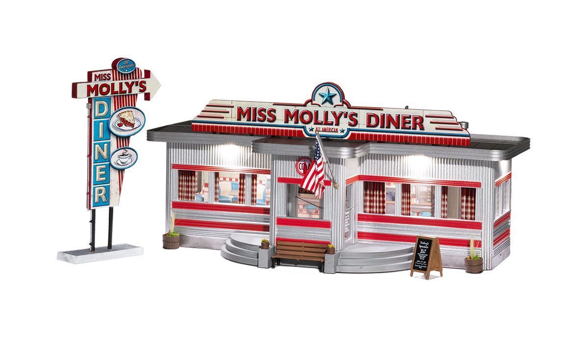 Miniature model of Miss Molly's Diner with red-and-white striped facade and matching roadside sign.