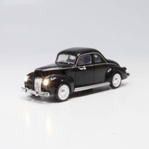 Black vintage toy car with chrome details on a white background