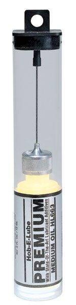 Clear plastic syringe-style tube with black cap and hanging loop, containing liquid inside