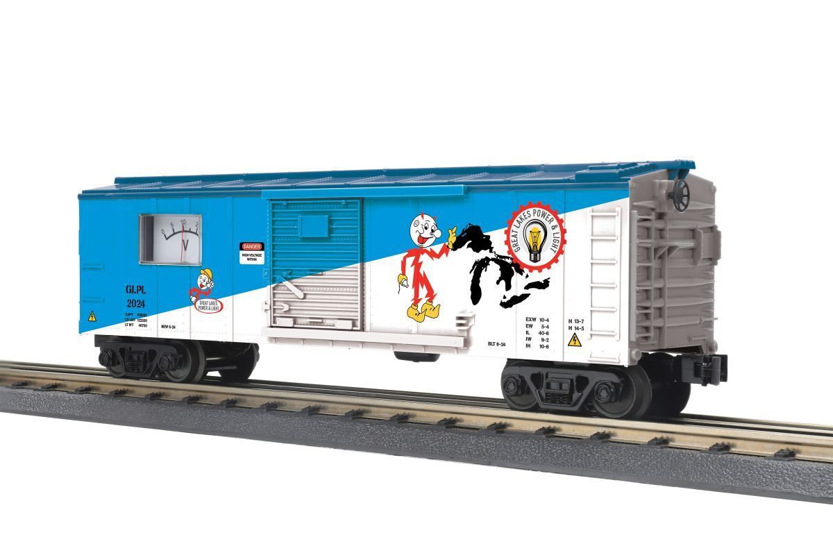Blue and white boxcar with colorful holiday graphics on train tracks