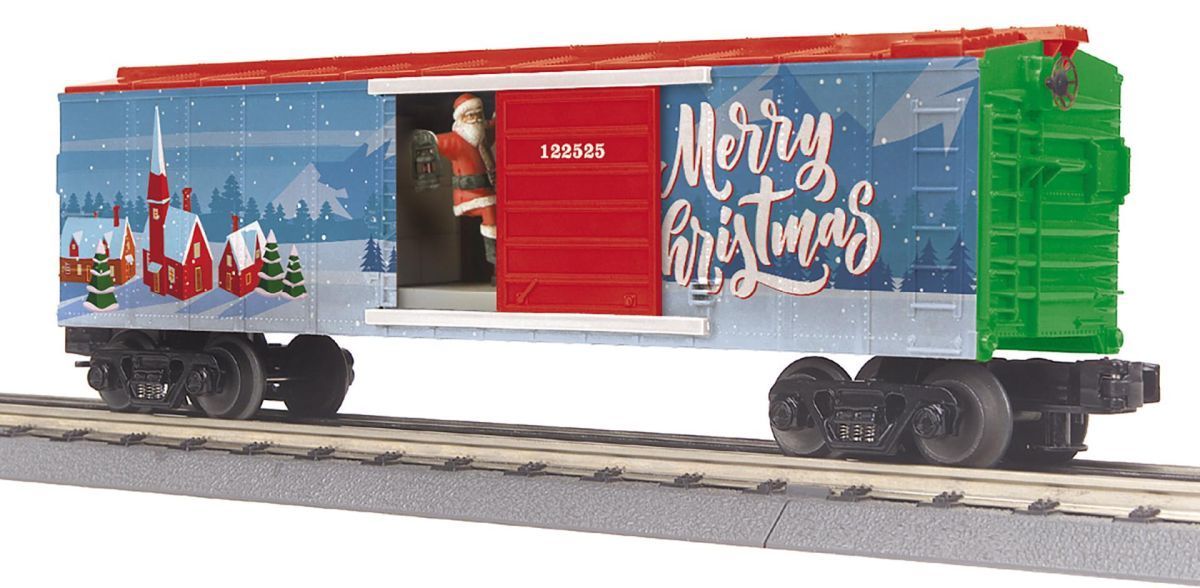 Red and blue holiday-themed train car with "Merry Christmas" lettering on a track, beside a green engine.