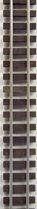 Vertical rows of dark window-like panels on a beige building facade