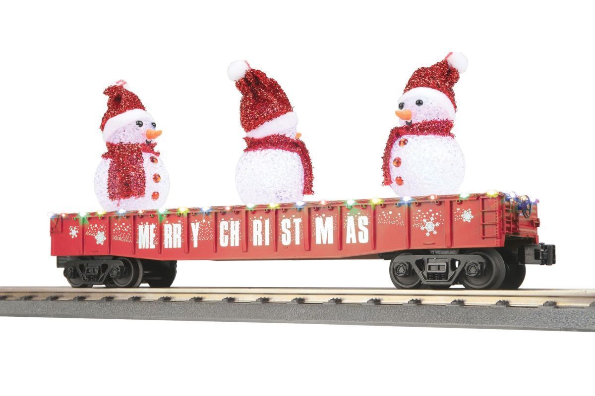 Three snowmen riding a red holiday train car on tracks