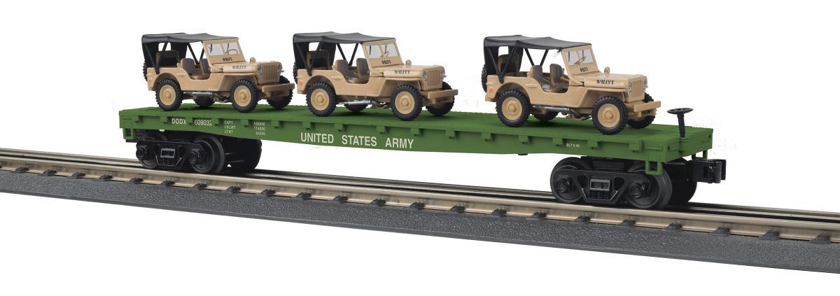 Toy military vehicles on a green railcar model train track