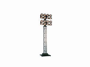 Tall silver stadium light pole with multiple lights on top