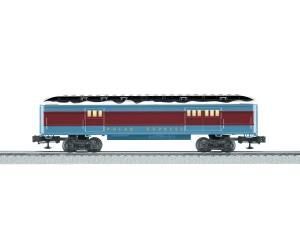 Side view of a red and blue passenger train car on tracks