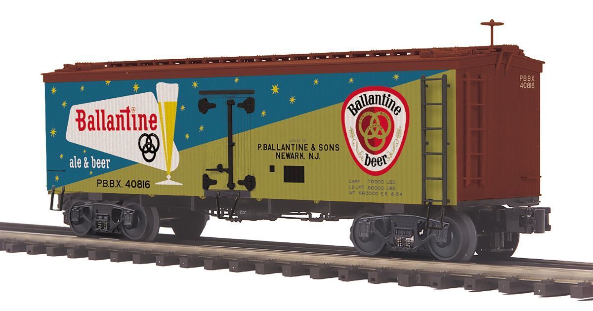 Ballantine Ale boxcar model train in red and yellow on rails