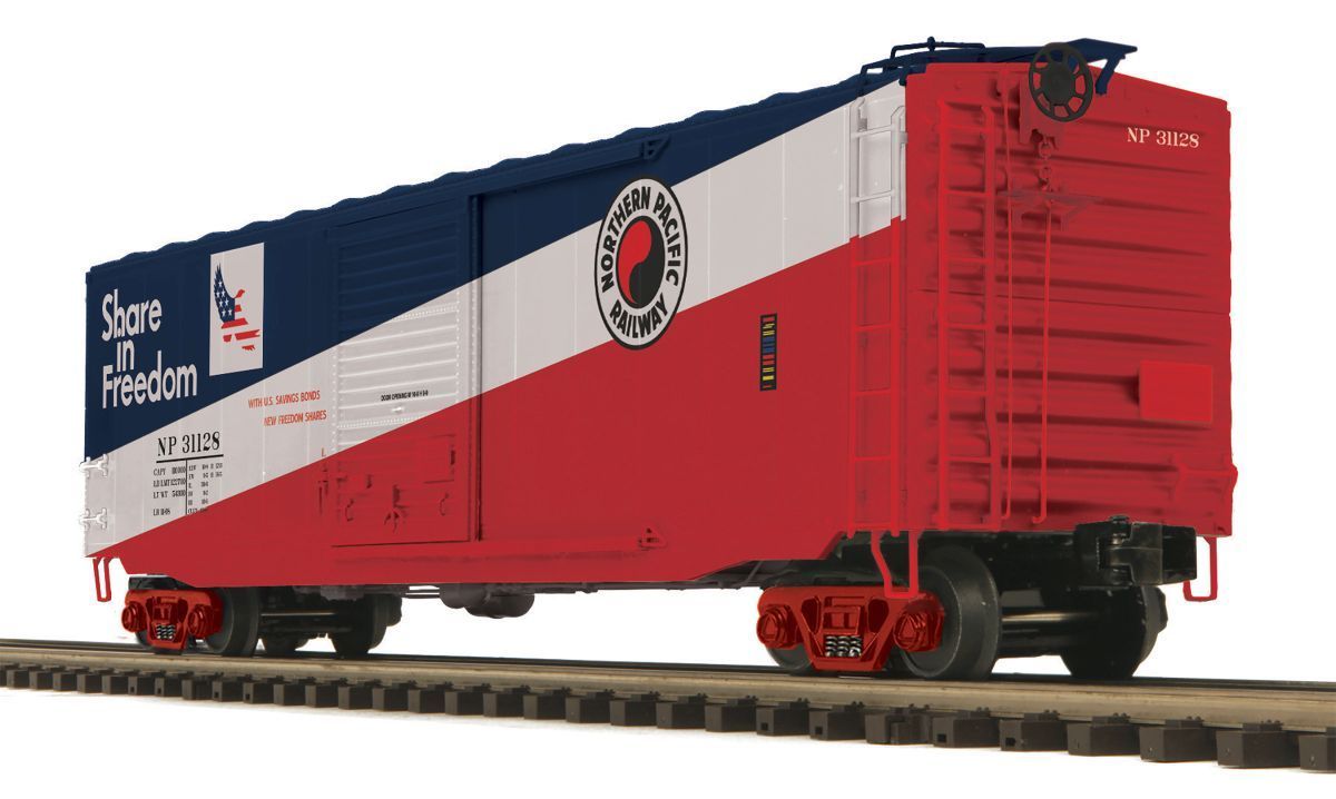 Red and white freight boxcar on tracks with blue roof and rail company logo