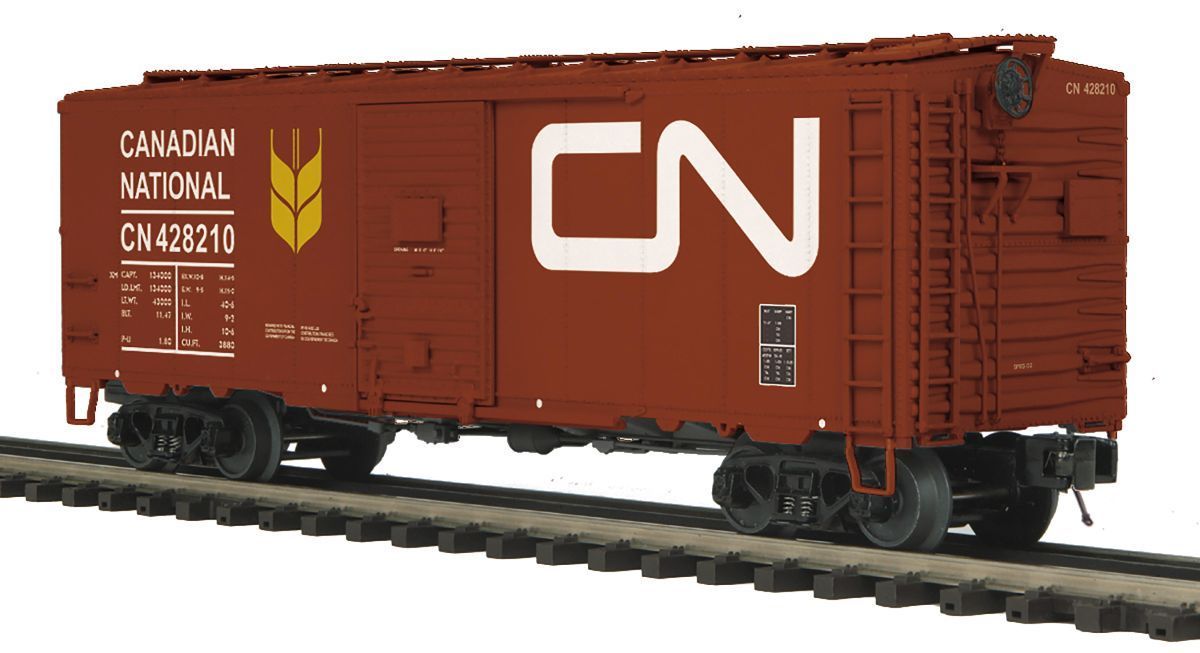 Red Canadian National CN boxcar on railroad tracks, shown in side view
