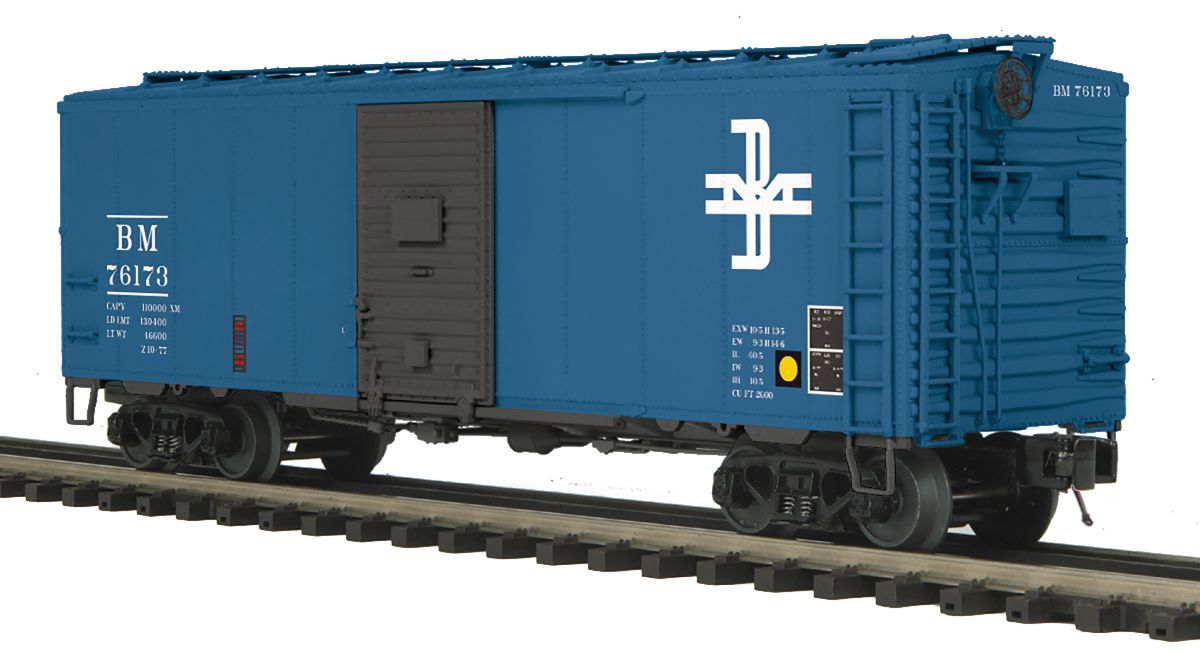 Blue boxcar freight train on tracks with white markings and a side door.
