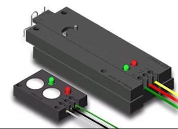 Black electronic device with red and green indicator lights and connected wires next to a small sensor module