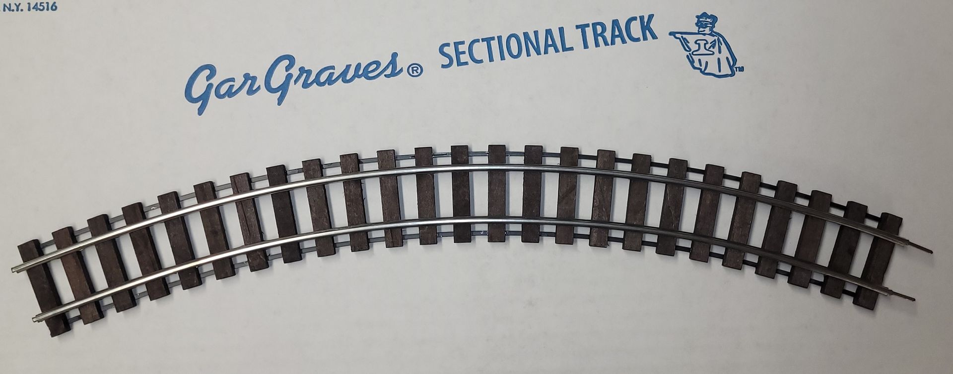 Curved model railroad track labeled “GarGraves Sectional Track” on a white background