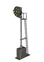 Tall black railway signal lamp on a ladder-like pole with a base cabinet