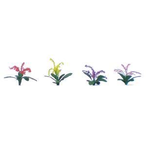 Four small decorative plants in pink, yellow, purple, and lavender on a white background