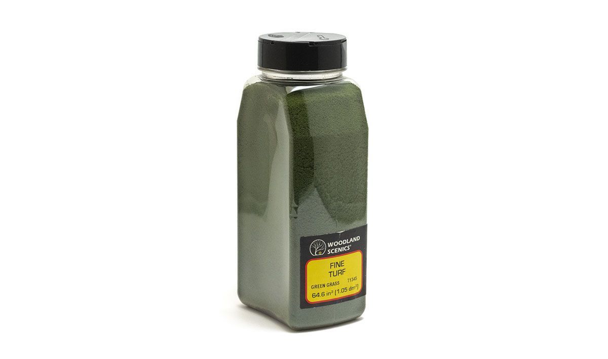 Green rectangular plastic bottle with black cap and yellow label