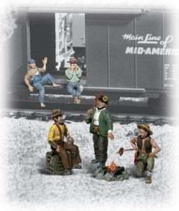 Miniature train scene with four figures standing and sitting in snow beside a railroad car.