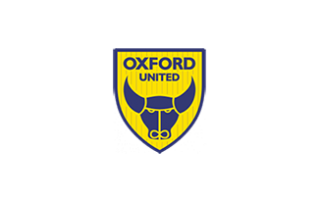 Oxford United yellow and blue football club crest with ox head and football wheel design