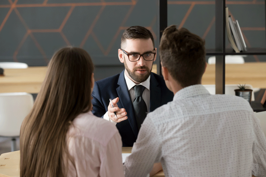 Lawyer Man Talking Two Clients in Front View — Mansfield, OH — John S. Dilts, Attorney