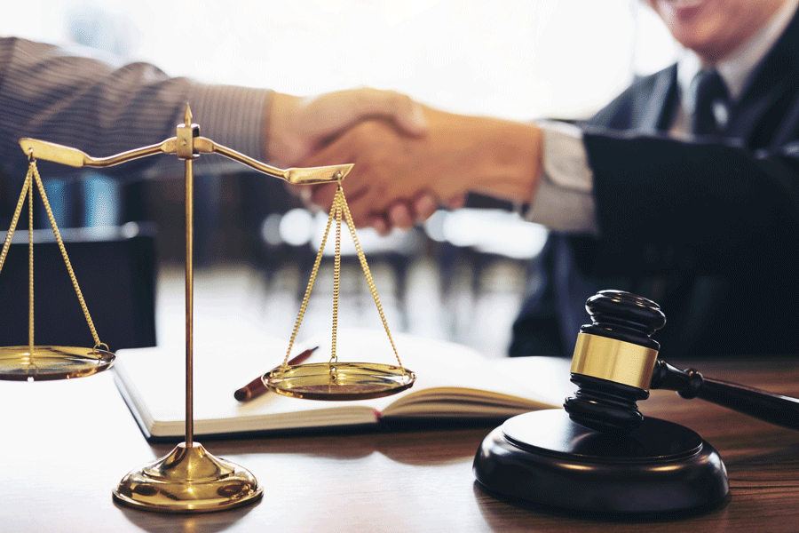 Lawyer Man Handshaking to the Client Man — Mansfield, OH — John S. Dilts, Attorney