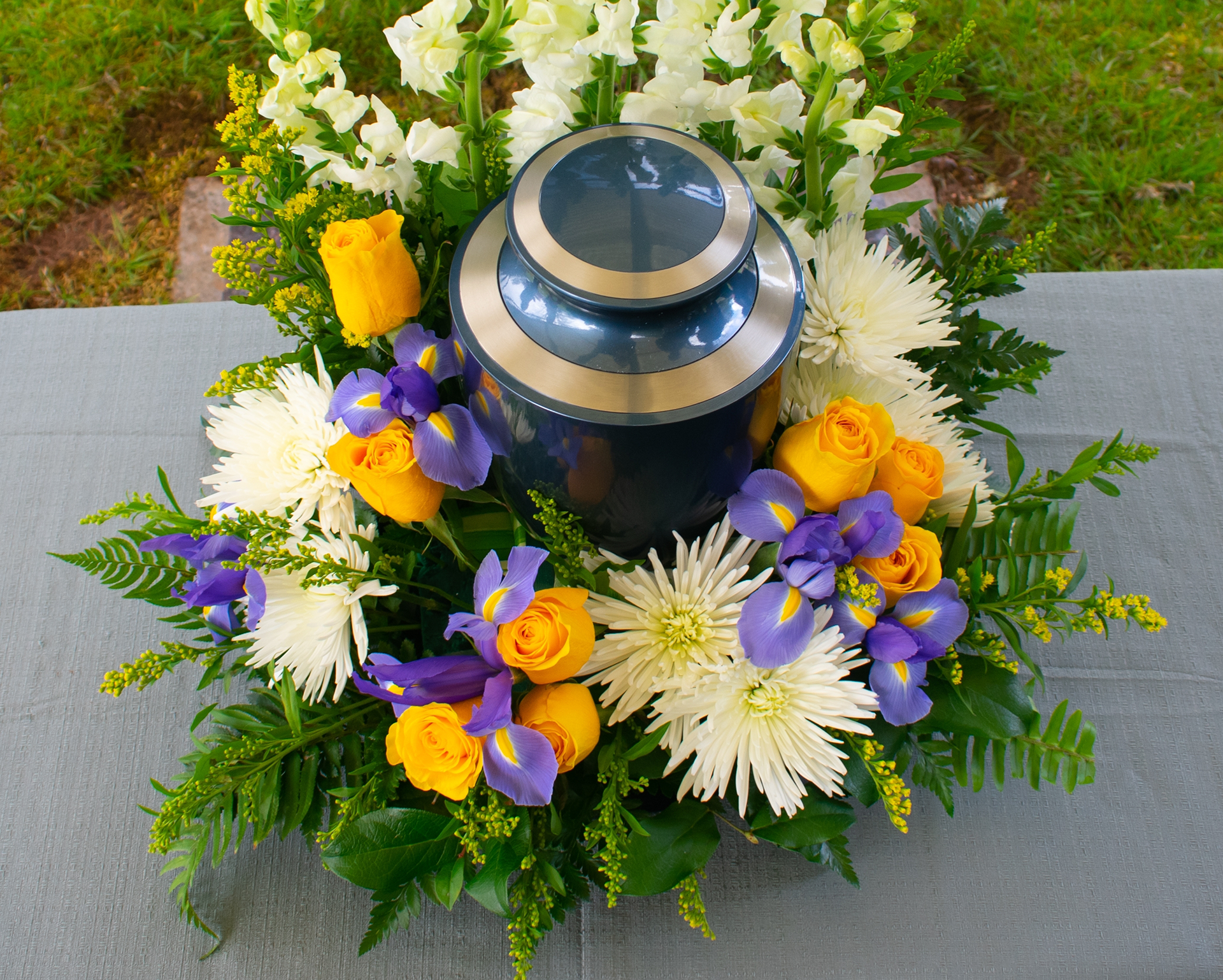 Urn With Orange And Purple Flowers