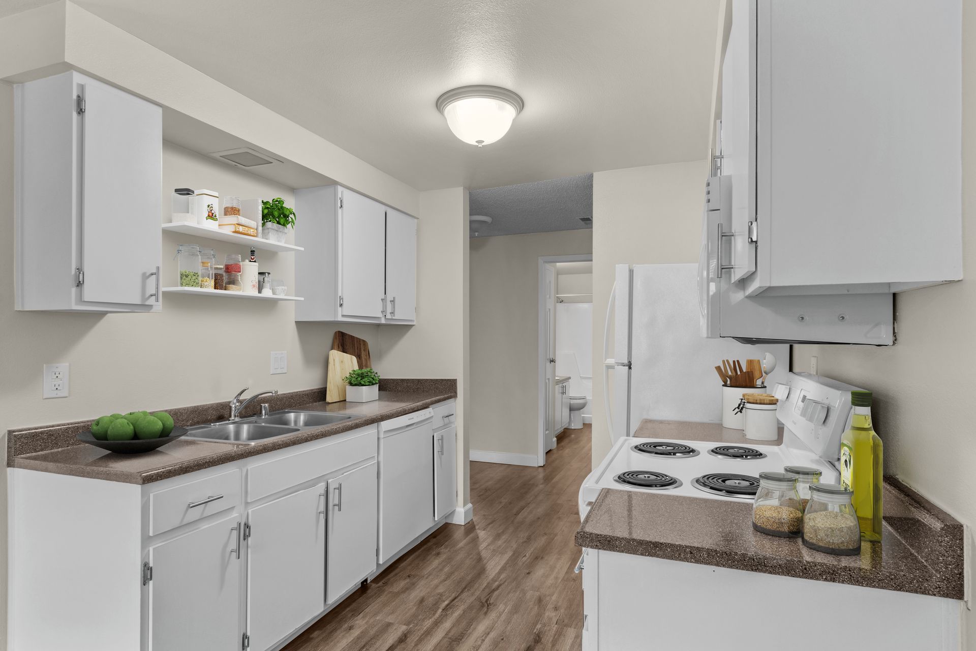 spacious kitchen with dishwasher, microwave, range, and refrigerator