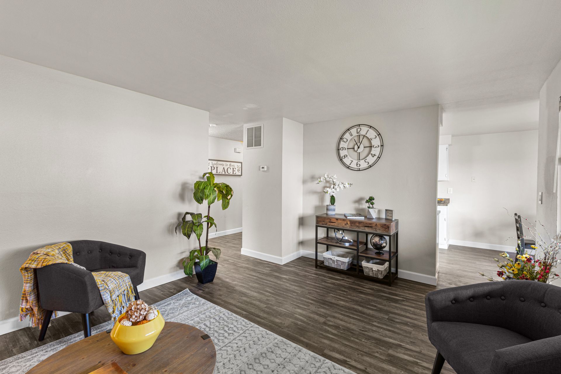 spacious living room area with large window