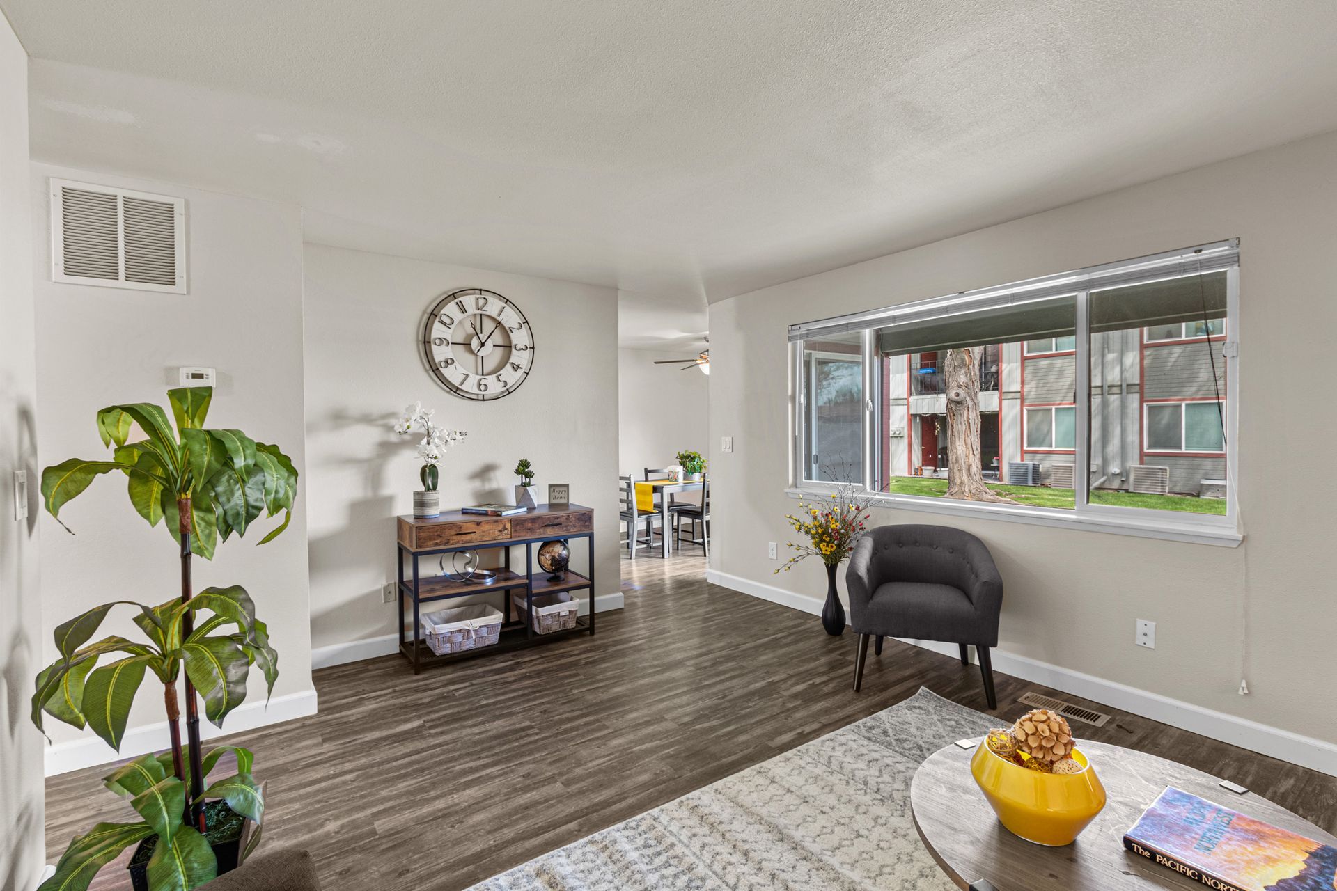 spacious living room area with large window