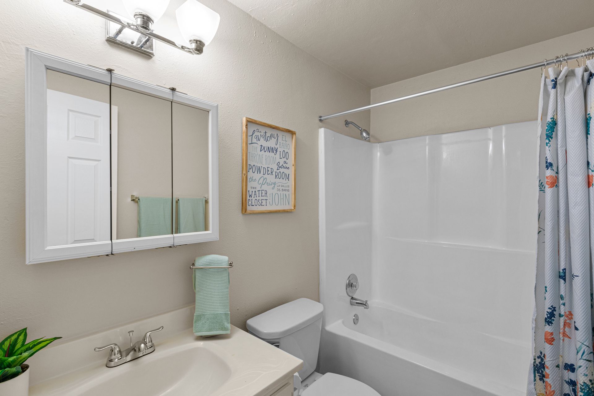 spacious bathroom with tub and shower plus linen closet