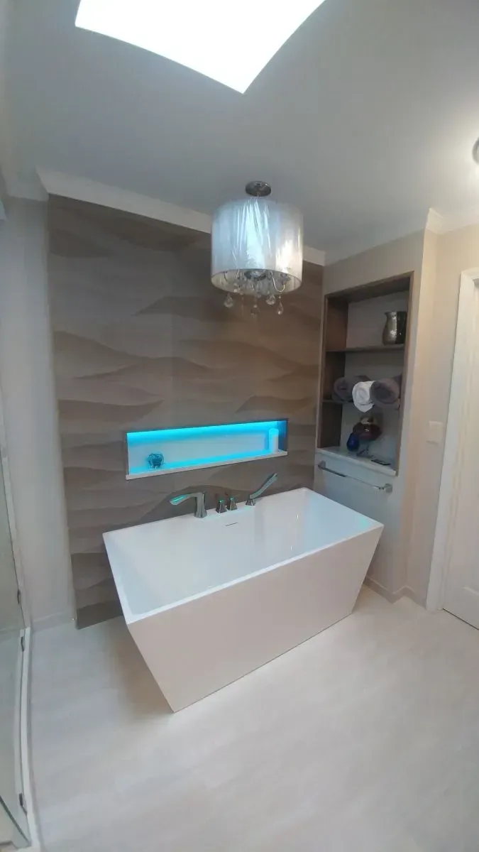 There is a bathtub in the middle of the bathroom.