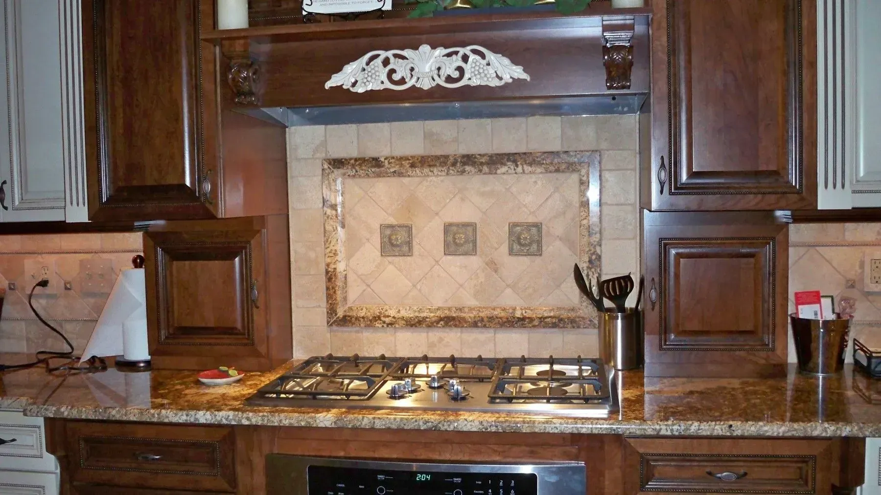 A kitchen with wooden cabinets and a stove top oven
