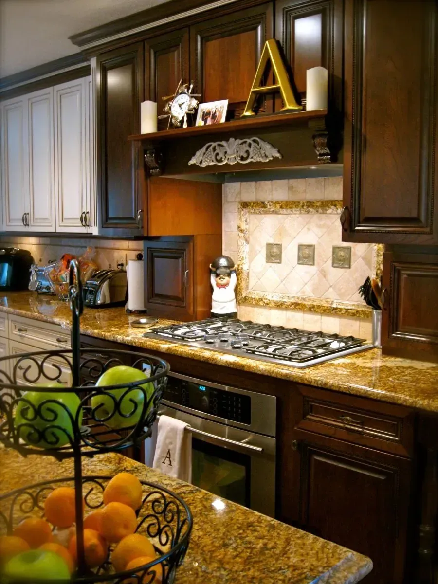 A kitchen with the letter a above the stove