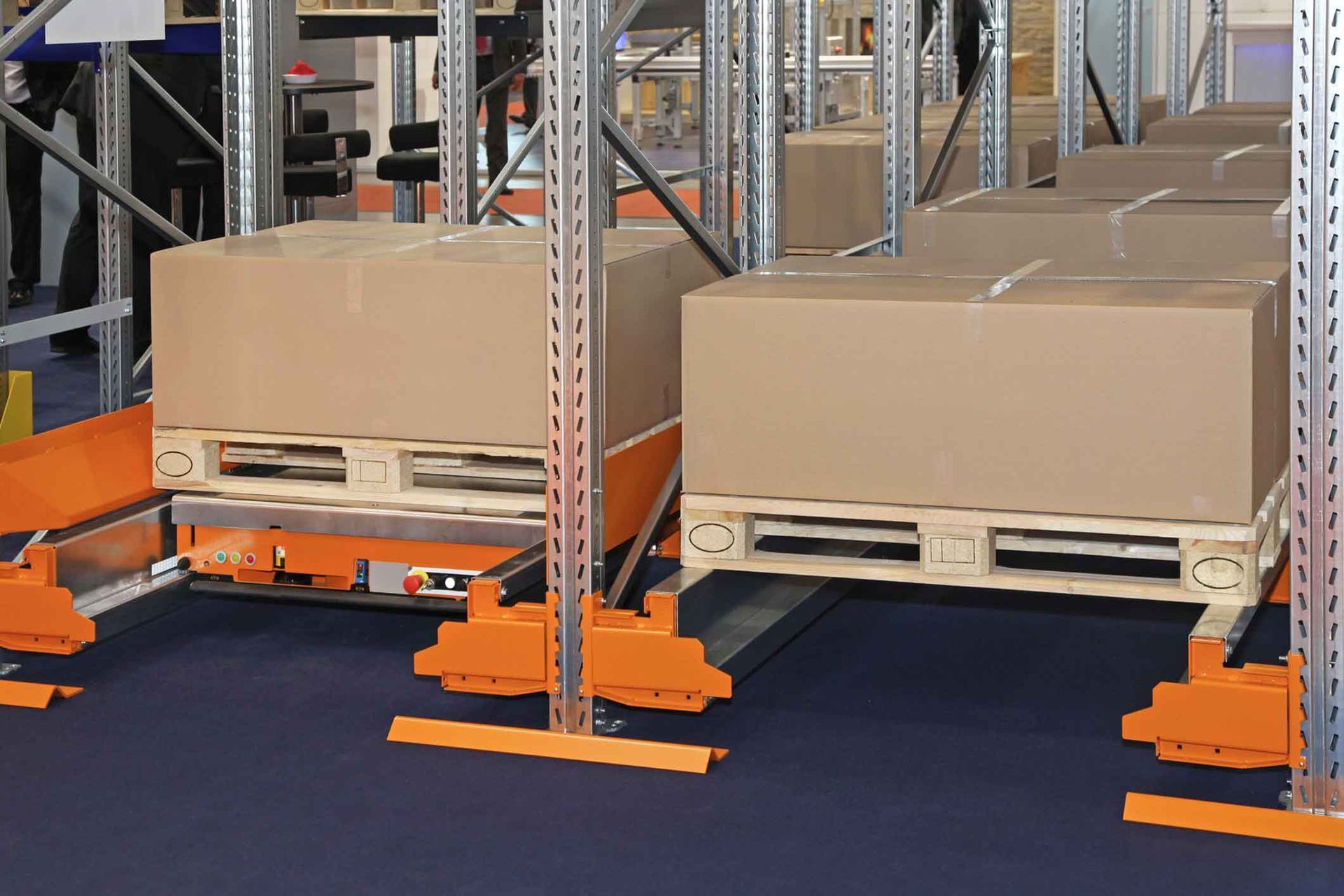 Two pallets with boxes on them are in a warehouse.
