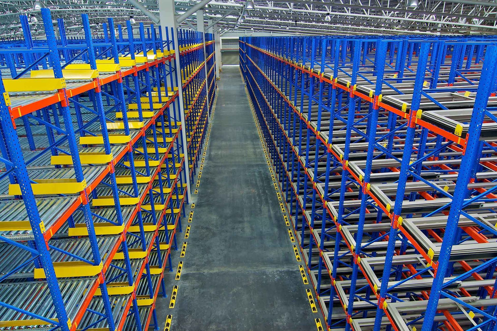 A warehouse filled with lots of blue and yellow shelves